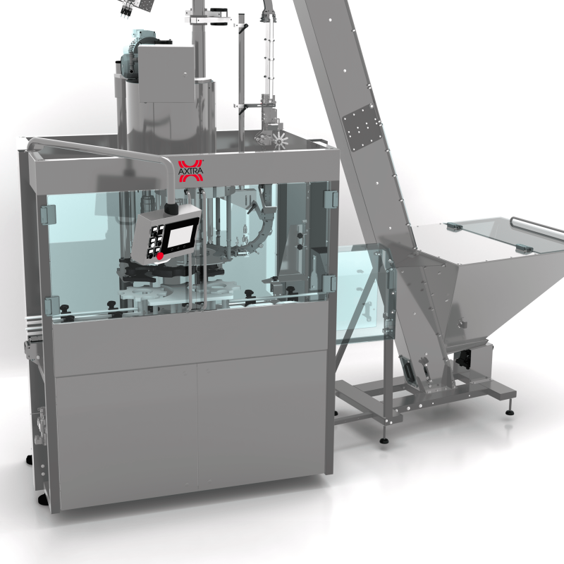 Front three-quarter view of the AXTRA Guala caps machine showing the touchscreen control panel and guarded capping chamber