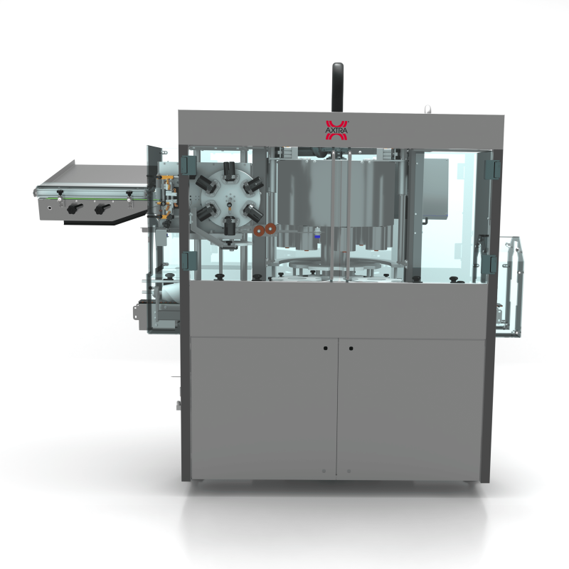 Front view of the AXTRA short PVC capsules machine showing the bottle infeed conveyor and capsule orientation wheel