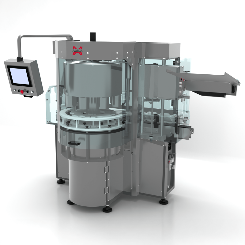 Rear three-quarter view of the AXTRA short PVC capsules machine showing the capsule feeding chute and rotary applicator