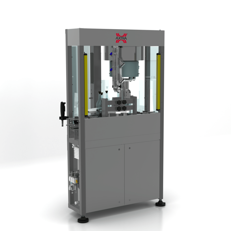 Front three-quarter view of the AXTRA pressure-seal T caps machine showing the pick-and-place head above a grid of bottles