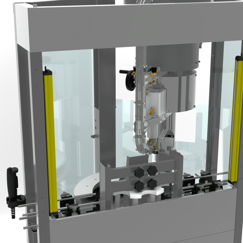 Close-up view inside the AXTRA crown cap machine showing the crimping head positioned above bottles held in the fixture