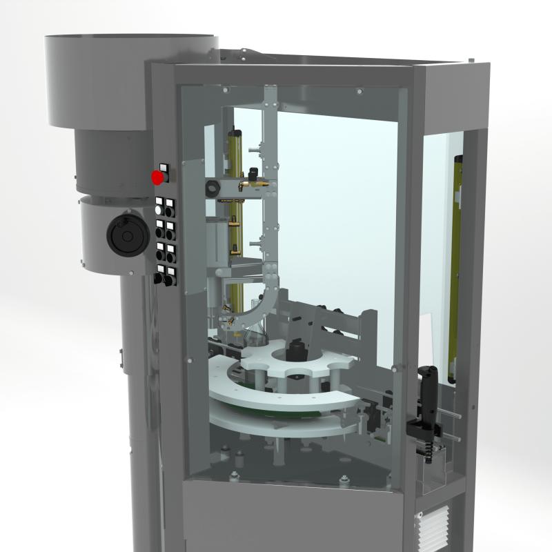 Back view of the AXTRA crown cap machine showing the cap sorting hopper and rotary transfer platform