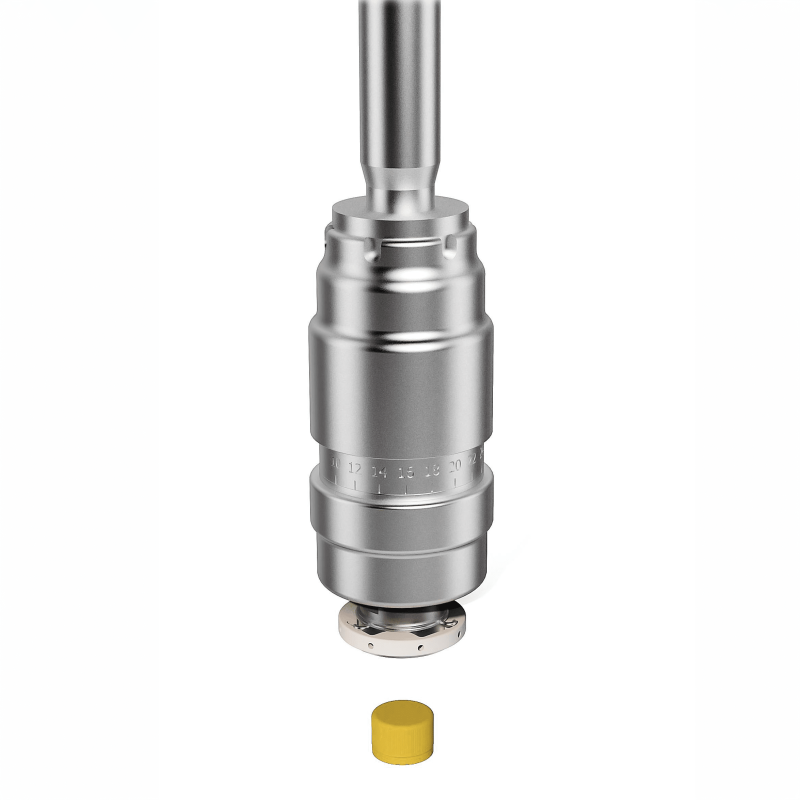 Detail of an AXTRA torque-controlled spindle capping head positioned above a pre-threaded plastic cap